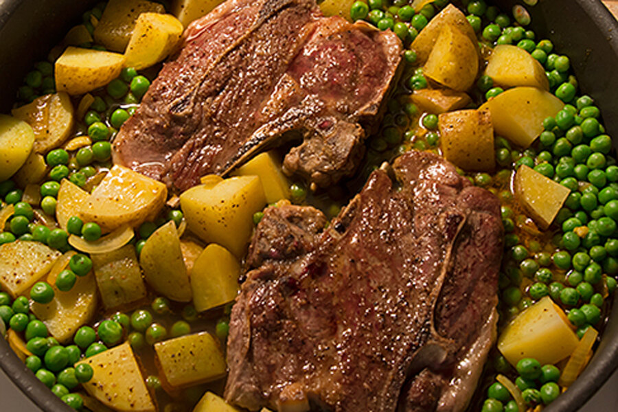 Braised lamb chops with potatoes, peas, and cumin